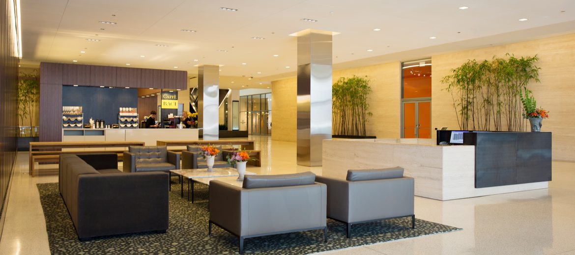 Major aspects of the lobby and common area project included a distinctive wood feature-wall separating the hotel access lobby from the office portion, and adding furniture and amenities to create a welcoming gathering space for tenants and their guests. 