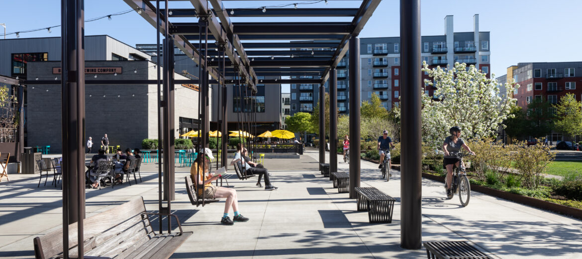 Outdoor spaces including a cycle track providing a  protected bike connection to the 42-mile Eastrail