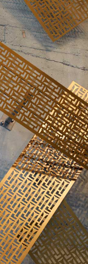 Reclaimed brass made into artwork hanging in the 9th Street lobby at Market Square in San Francisco.